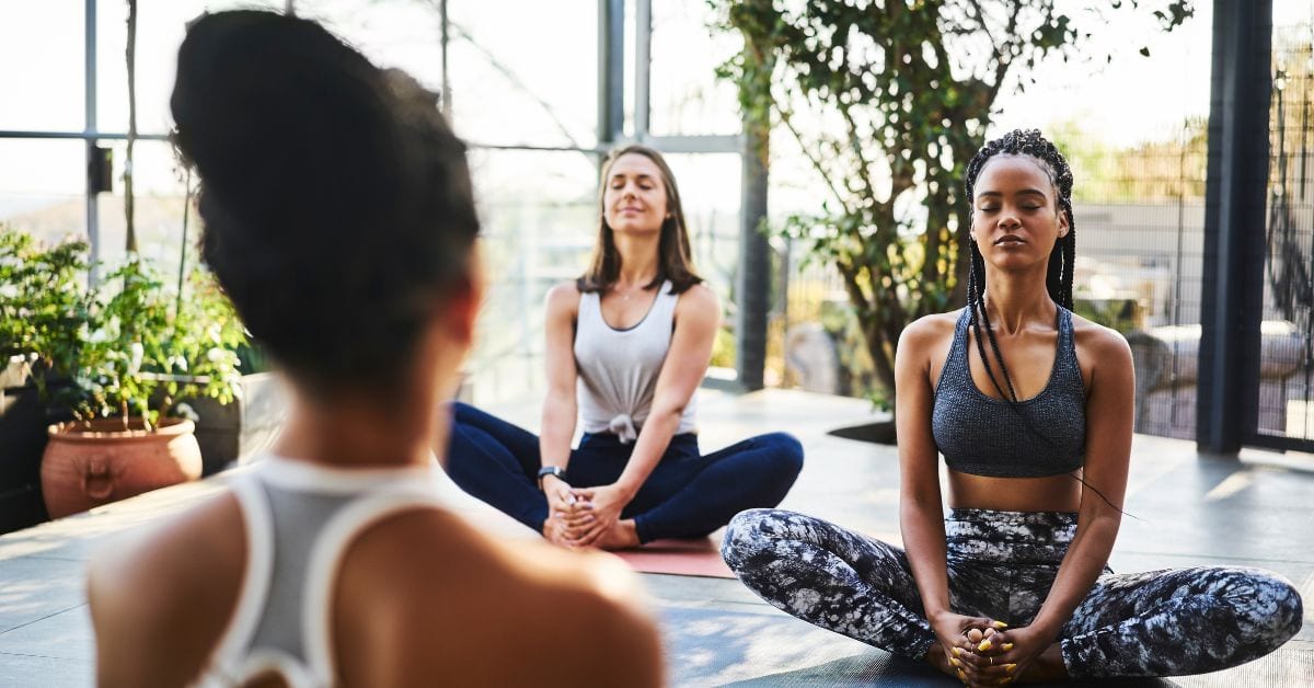 teacher and small group yoga class