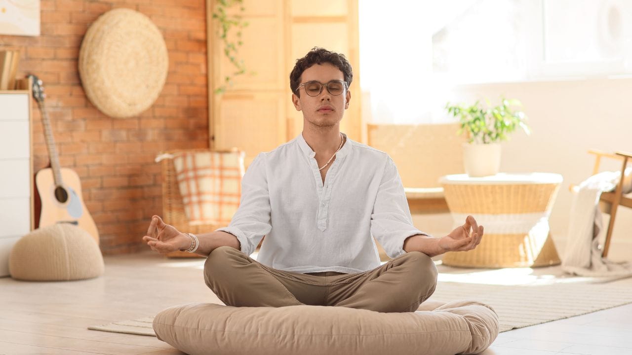 a man sitting doing Mindfulness-Based Cognitive Therapy meditation