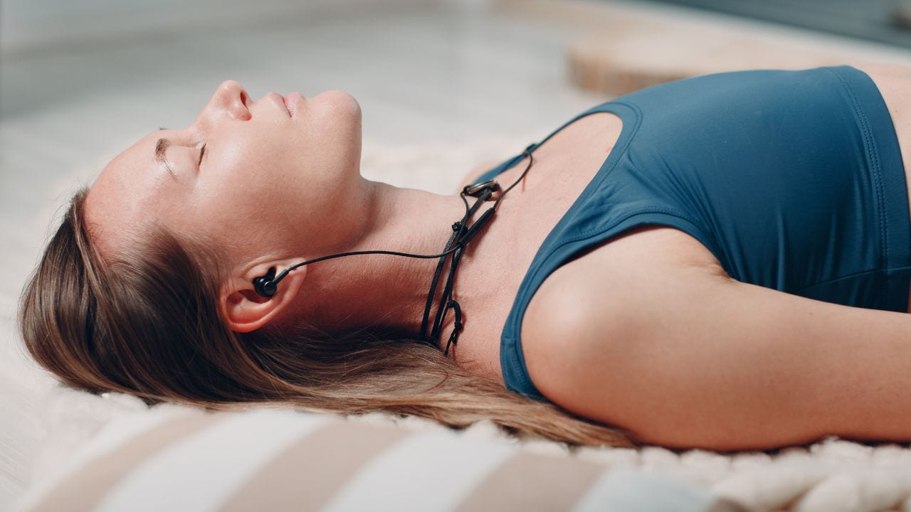 woman lying for yoga nidra meditation technique