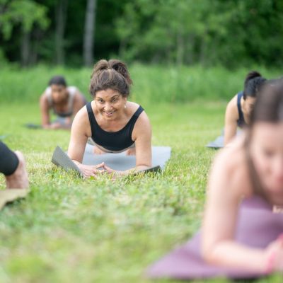 student doing plank in garden